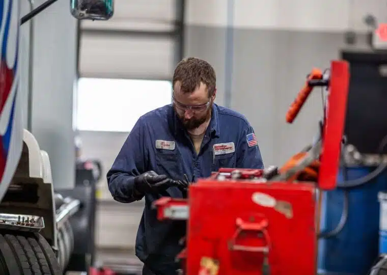 Garage technician looking in toolbox